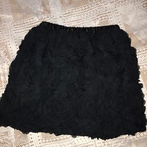 Black skirt with tufted roses